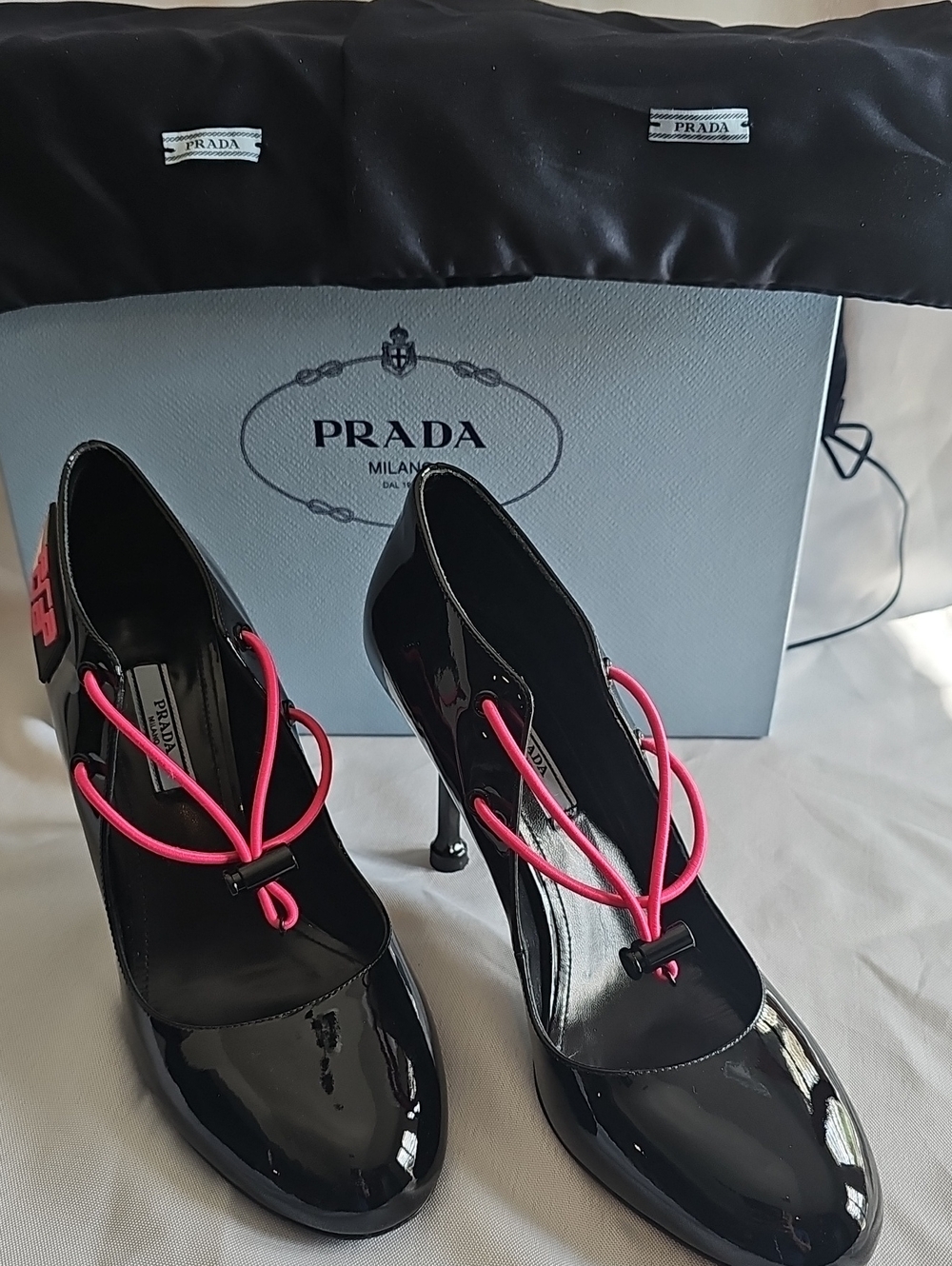 Prada Black Patent Leather Heels with Pink Cord Detail And Branding